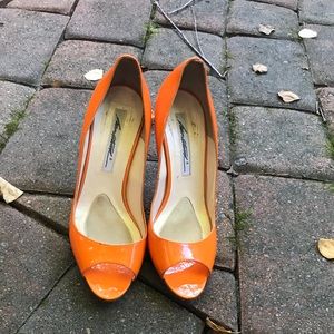 Brian Atwood peep toe pumps in orange 🍊
